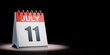 July 11 Calendar Spotlighted on Black Background