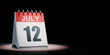 July 12 Calendar Spotlighted on Black Background