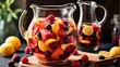 A glass pitcher of sangria filled with sliced fruit and ice cubes