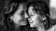 Black and white photo capturing a close and affectionate moment between a mother and her daughter, sharing a loving gaze.