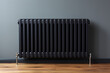 Black modern radiator battery heating on the wall. Home heater convector isolated. Heating convector