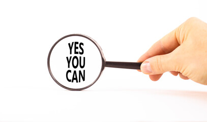 Wall Mural - Motivational Yes you can symbol. Concept words Yes you can in beautiful magnifying glass. Beautiful white table background. Businessman hand. Business motivational and Yes you can concept. Copy space