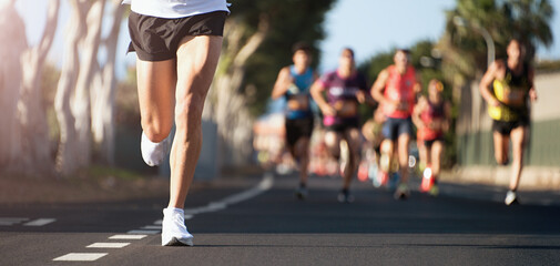 Poster - Marathon running in the light of morning. People feet on city road