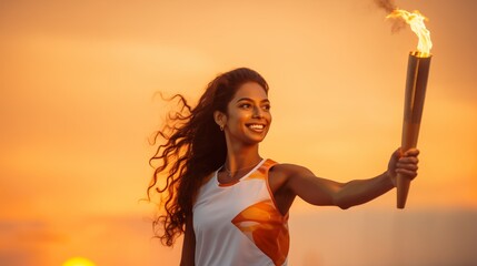 Wall Mural - A beautiful Indian athlete girl solemnly carries the Olympic flame against the background of a colorful sunset in the sky