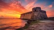 Coastal fort aglow in the brilliance of a vibrant sunset