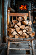 Pile of wood on chair in front of fireplace.