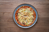 Fototapeta Desenie - Italian homemade pizza with salmon and onions and parmesan, Italian cooking