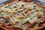 Fototapeta Desenie - Italian homemade pizza with salmon and onions and parmesan, Italian cooking