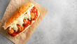 © Chidori_studio - meatball dish, meatball sandwich. top view shot of meatball sub sandwich with cheese and marinara tomato sauce, copy space