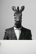 Man in suit holding blank board with zebra head in black and white image