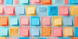 Vibrant assortment of colorful postit notes in blue, orange, pink, and yellow on a wall
