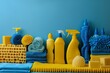 Blue and yellow sponge, rags, and bottles for effective spring cleaning supplies