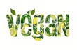 Das Wort Vegan mit Zitronen und grünem Blätter Muster auf weißem Untergrund 