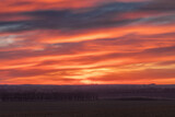 Fototapeta Miasta - Colorful Sunset in the fields 