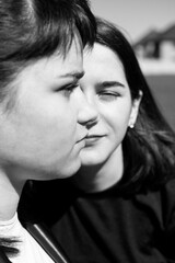 Wall Mural - Close up portrait of a two young women	