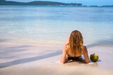 Fototapeta Uliczki - A girl on a tropical beach