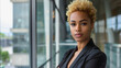 Young african business woman with blond short afro hair looking serious on camera inside modern office - Models by AI generative