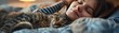 Sleepy cat and human companion napping together in perfect harmony