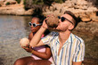 © Lucas Ottone/Stocksy - Young interracial couple summer portrait