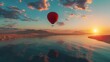 A hot air balloon shaped like a heart floats elegantly over a body of water, casting a reflection on the calm surface below. The colorful balloon stands out against the blue sky as it moves gracefully