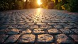 Sunlit cobblestone after rain with golden reflections at sunset