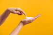 © Marc Tran/Stocksy - white Soapy foam bubbles texture on woman hand