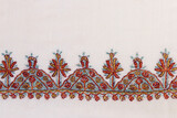 Fototapeta Maki - Border with white traditional Kashmiri stitch embroidery on a scarf.