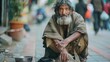 guy faced beggar with ragged clothes begs on the street