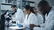 © Nicholas - A diverse group of focused scientists is working in a modern laboratory, using microscopes and taking notes for their research