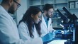 © Nicholas - Skilled scientists are intently analyzing biological samples under microscopes in a high-tech laboratory