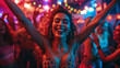 A woman is dancing and smiling in a club with other people. Scene is lively and fun