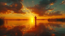 Man Fishing On Lake At Sunset