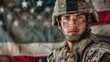 © sidatallah - Portrait of a young soldier wearing a helmet and camouflage uniform with an American flag in the background