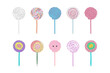 Colorful lollipops are placed on top of each other in a vertical stack. Each sweet treat stands out with its unique shape and vibrant hue, creating a visually appealing composition