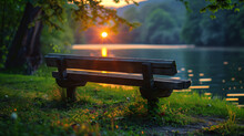 A Wooden Bench Is Sitting On A Grassy Hill Overlooking A Lake