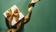 top view of open gift box or present box with gold ribbon and bow on green background with shadow