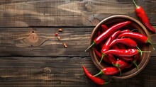 Red Hot Chili Peppers In Bowl Over Wooden Background