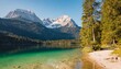 impressive summer sunrise on eibsee lake with zugspitze mountain range sunny outdoor scene in german alps bavaria germany europe beauty of nature
