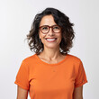 © Image-Love - A woman wearing an orange shirt and glasses is smiling. She is wearing a necklace and has her teeth showing