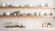 Kitchen shelves with different utensils on white brick wall background