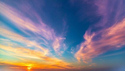 vivid sky color background abstract wispy gold purple pink blue green yellow red and orange sunset colors in cloudy artistic pattern fun colorful background