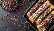  top view, assorted mini cannoli decorated with colorful sprinkles and chocolate chips