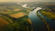 Aerial view of European classical styled with river and cultivated agricultural farming land shot from the air