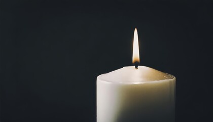 Canvas Print - burning candle on black background