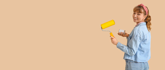 Sticker - Young woman with paint roller and can on beige background. Repair concept