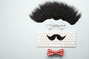 Wall Mural - Flat lay composition with artificial moustache and glasses on light grey background, space for text