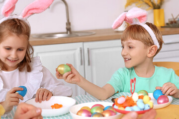 Sticker - Little children with Easter eggs having dinner in kitchen