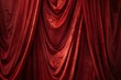 Elegant red velvet fabric draped luxuriously, rich texture for theater, fashion, or luxe design concepts, with deep color and dramatic folds.

