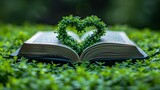 Fototapeta  - Open book on green grass background with a heart shape, Open book on a green grass environment with heart made of leaves
