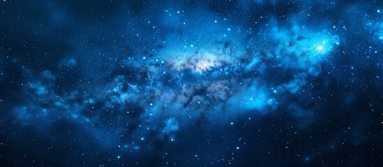 Wall Mural - a mesmerizing blue galaxy scattered with twinkling stars set against a deep black backdrop, creating